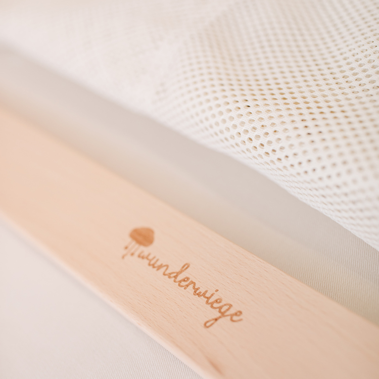 Stoff Federwiege beige mit Wunderwiege Logo